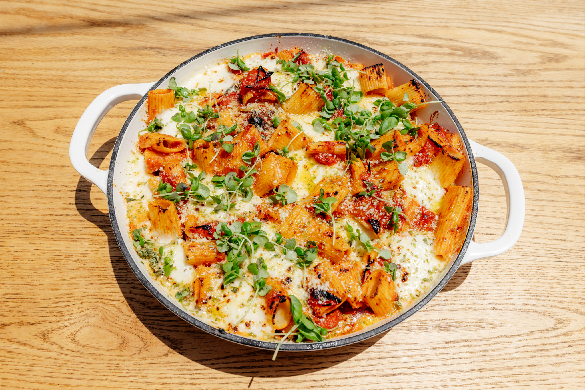 Baked Rigatoni with blistered cherry tomatoes, fresh mozzarella and fennel pollen