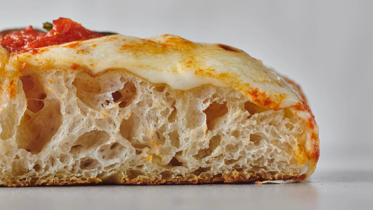 Pizza slice side view. recipe poster image