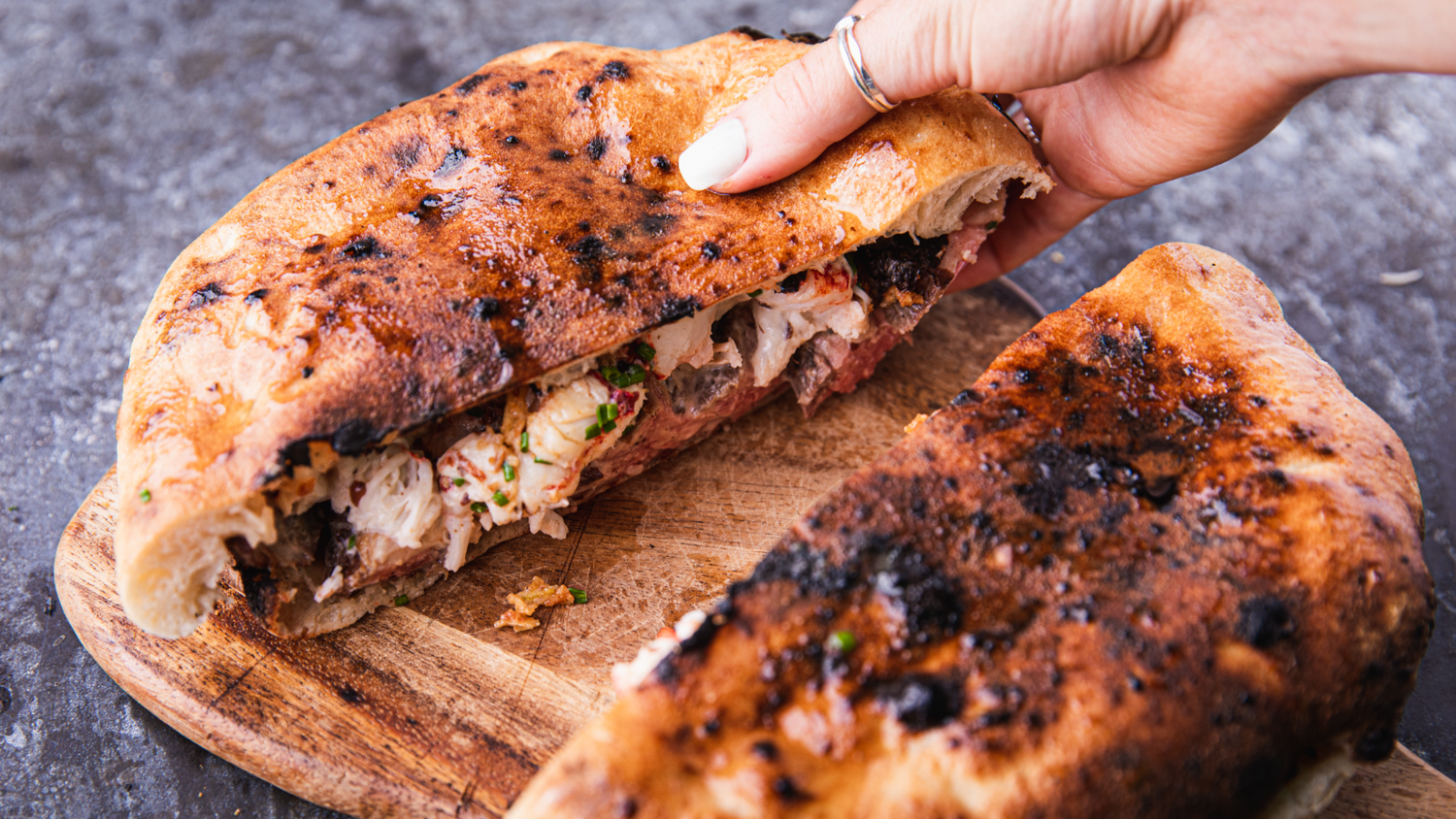 Steak and Lobster Panuozzo cut in half recipe poster image